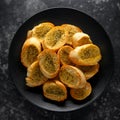 Fresh Garlic Bread, toast on black plate Royalty Free Stock Photo