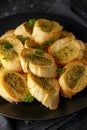 Fresh Garlic Bread, toast on black plate Royalty Free Stock Photo