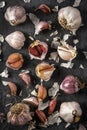 Fresh garlic bulbs and cloves grouped on black background Royalty Free Stock Photo