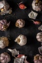 Fresh garlic bulbs and cloves grouped on black background Royalty Free Stock Photo