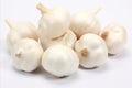 Fresh garlic bulbs on white backdrop for captivating ads and packaging designs that grab attention