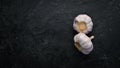 Fresh garlic on a dark background. Vegetables. Royalty Free Stock Photo