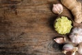 Fresh garlic, ginger and space for text on table, flat lay. Natural cold remedies Royalty Free Stock Photo