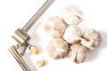 Fresh Garlic isolated on white background close-up. Fresh garlic with metal garlic extruder, press Royalty Free Stock Photo