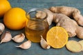 Fresh garlic and other natural cold remedies on blue wooden table Royalty Free Stock Photo