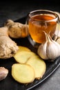 Fresh garlic and other natural cold remedies on table Royalty Free Stock Photo