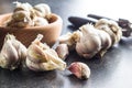Fresh garlic and garlic presser. Royalty Free Stock Photo