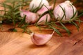 Fresh garlic with rosemary in background Royalty Free Stock Photo