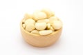 Fresh garlic on wooden bowl, on white Royalty Free Stock Photo