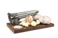 Fresh garlic in your head and brushed your teeth,the garlic press,salt on wooden tray,isolated white background,close-up Royalty Free Stock Photo