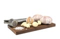 Fresh garlic in your head and brushed your teeth,the garlic press,salt on wooden tray,isolated white background,close-up Royalty Free Stock Photo