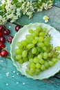 Fresh geeen grapes and red cherries Royalty Free Stock Photo