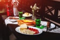 fresh Georgian meal with khachapuri, shashlik kebab with beef or lamb meat, tomato with cheese and green tarragon drink