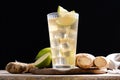 Fresh ginger ale drink in tall glass on wooden table Royalty Free Stock Photo
