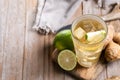 Fresh ginger ale drink in tall glass on wooden table Royalty Free Stock Photo