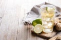 Fresh ginger ale drink in tall glass on wooden table Royalty Free Stock Photo