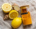 Fresh ginger and lemon with ground turmeric Royalty Free Stock Photo