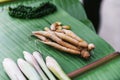 Fresh ginger and many spices on banana leaves. Example of spicy and aromatic taste of coffee