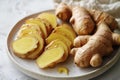 Fresh ginger root on white plate over white textured background, top view Royalty Free Stock Photo