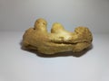 Fresh Ginger Root on White Surface. Royalty Free Stock Photo