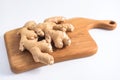 Fresh ginger root on wood board Royalty Free Stock Photo