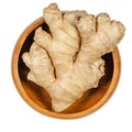 Fresh ginger root, rhizome of Zingiber officinale in wooden bowl Royalty Free Stock Photo