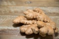 Fresh ginger root on the wooden table