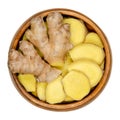 Fresh ginger roots, whole and sliced, in a wooden bowl Royalty Free Stock Photo