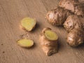 Fresh Ginger on wooden texture background stock image.