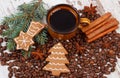Fresh gingerbread, cup of coffee and grains, spices, christmas time Royalty Free Stock Photo