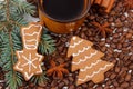 Fresh gingerbread, cup of coffee and grains, spices, christmas time Royalty Free Stock Photo