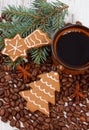 Fresh gingerbread, cup of coffee and grains, spices, christmas time Royalty Free Stock Photo