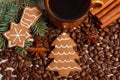 Fresh gingerbread, cup of coffee and grains, spices, christmas time Royalty Free Stock Photo