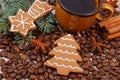 Fresh gingerbread, cup of coffee and grains, spices, christmas time Royalty Free Stock Photo