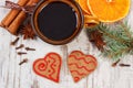 Fresh gingerbread, cup of coffee and spices on old wooden background Royalty Free Stock Photo