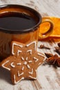 Fresh gingerbread, cup of coffee and spices on old wooden background, christmas time Royalty Free Stock Photo