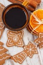 Fresh gingerbread, cup of coffee and spices on old wooden background, christmas time Royalty Free Stock Photo