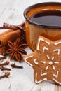 Fresh gingerbread, cup of coffee and spices on old wooden background, christmas time Royalty Free Stock Photo