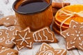 Fresh gingerbread, cup of coffee and spices on old wooden background, christmas time Royalty Free Stock Photo