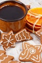 Fresh gingerbread, cup of coffee and spices on old wooden background, christmas time Royalty Free Stock Photo