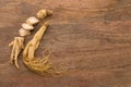Ginseng Root on Wooden Surface Royalty Free Stock Photo
