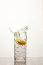 Fresh glass of water with lemon, water splash Royalty Free Stock Photo