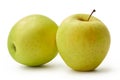 The fresh Golden Delicious apples are isolated on a white background.