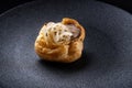 Fresh golden profiterole with pate. Gourmet cuisine, decorated with onions.