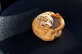 Fresh golden profiterole with pate. Gourmet cuisine, decorated with onions.