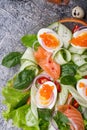 Fresh gourmet salad with red salmon caviar and eggs and vegetables. Protein luxury delicacy healthy food. beautifull served