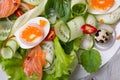 Fresh gourmet salad with red salmon caviar and eggs and vegetables. Protein luxury delicacy healthy food. beautifull served