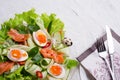 Fresh gourmet salad with red salmon caviar and eggs and vegetables. Protein luxury delicacy healthy food. beautifull served