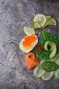 Fresh gourmet salad with salmon, caviar, eggs and vegetables. Protein luxury delicacy healthy food. beautifull served around