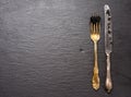 Fresh grainy black paddlefish caviar in metal fork on a black background Royalty Free Stock Photo